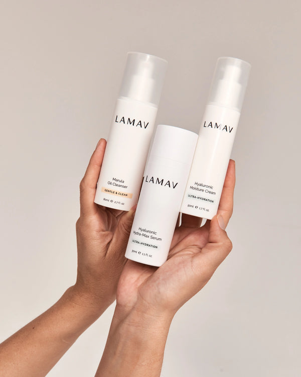 Hydration Organic Skincare Essentials by LAMAV — Hands holding cleanser serum and cream | Nourishing daily skin routine
