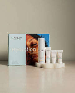 Hydration Skin Discovery Pack by LAMAV — Box and products on white stone pedestal | Plumper hydrated skin