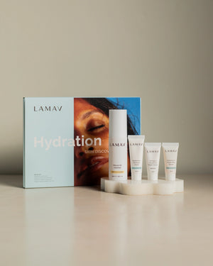 Hydration Skin Discovery Pack by LAMAV — Box and products on white stone pedestal | Plumper hydrated skin