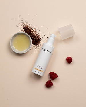 Marula Oil Cleanser by LAMAV — bottle with oil, coffee grounds and raspberries | nourishing antioxidant wash