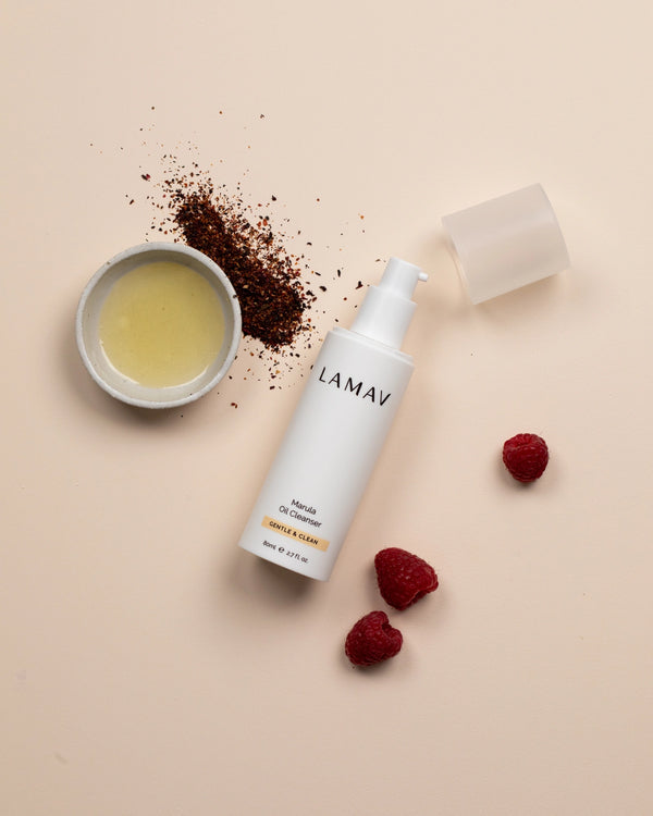 Marula Oil Cleanser by LAMAV — bottle with oil, coffee grounds and raspberries | nourishing antioxidant wash