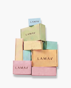 Mystery Box by LAMAV — a stack of colorful branded skincare boxes on a white background | surprise organic beauty bundle