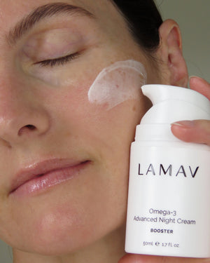 Omega-3 Advanced Night Cream by LAMAV — cream applied to woman's cheek | deep moisture