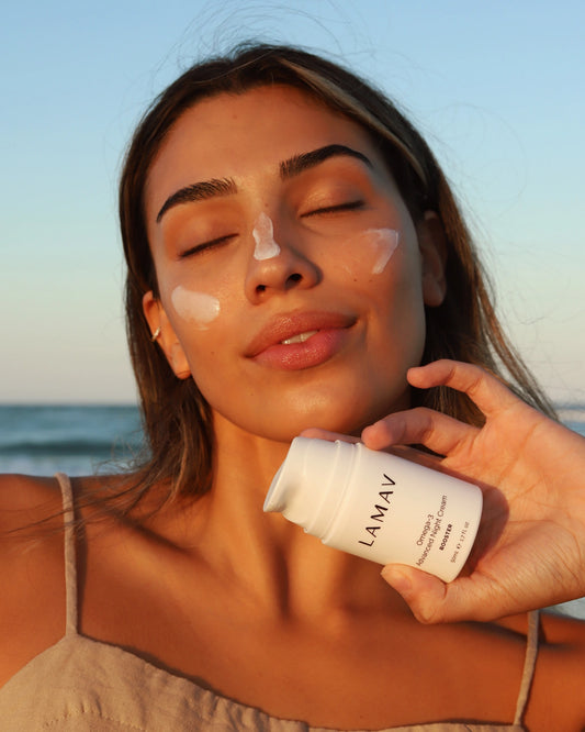 Omega-3 Advanced Night Cream by LAMAV — woman at beach with cream on face | restores elasticity