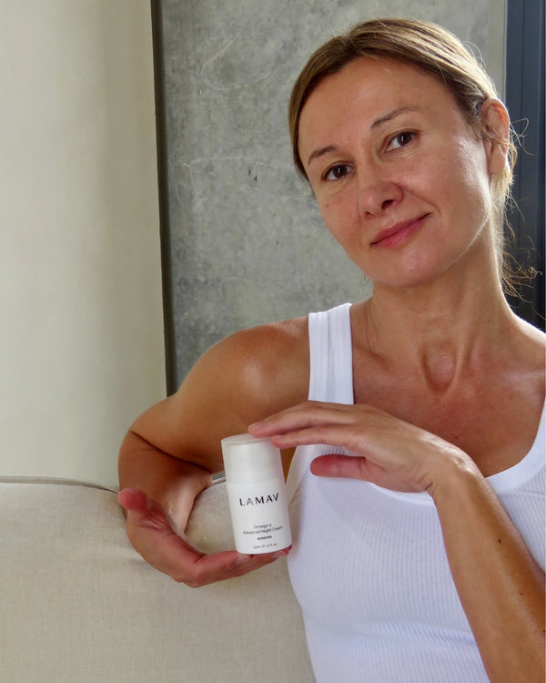 Omega-3 Advanced Night Cream by LAMAV — smiling woman holding bottle indoors | anti-aging