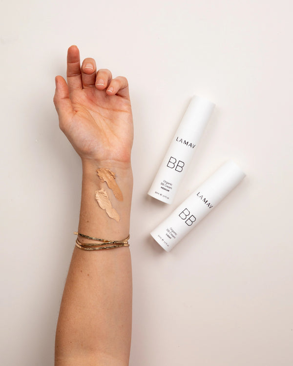 Organic BB Cream by LAMAV — arm with Light and Medium swatches next to bottles | vegan makeup