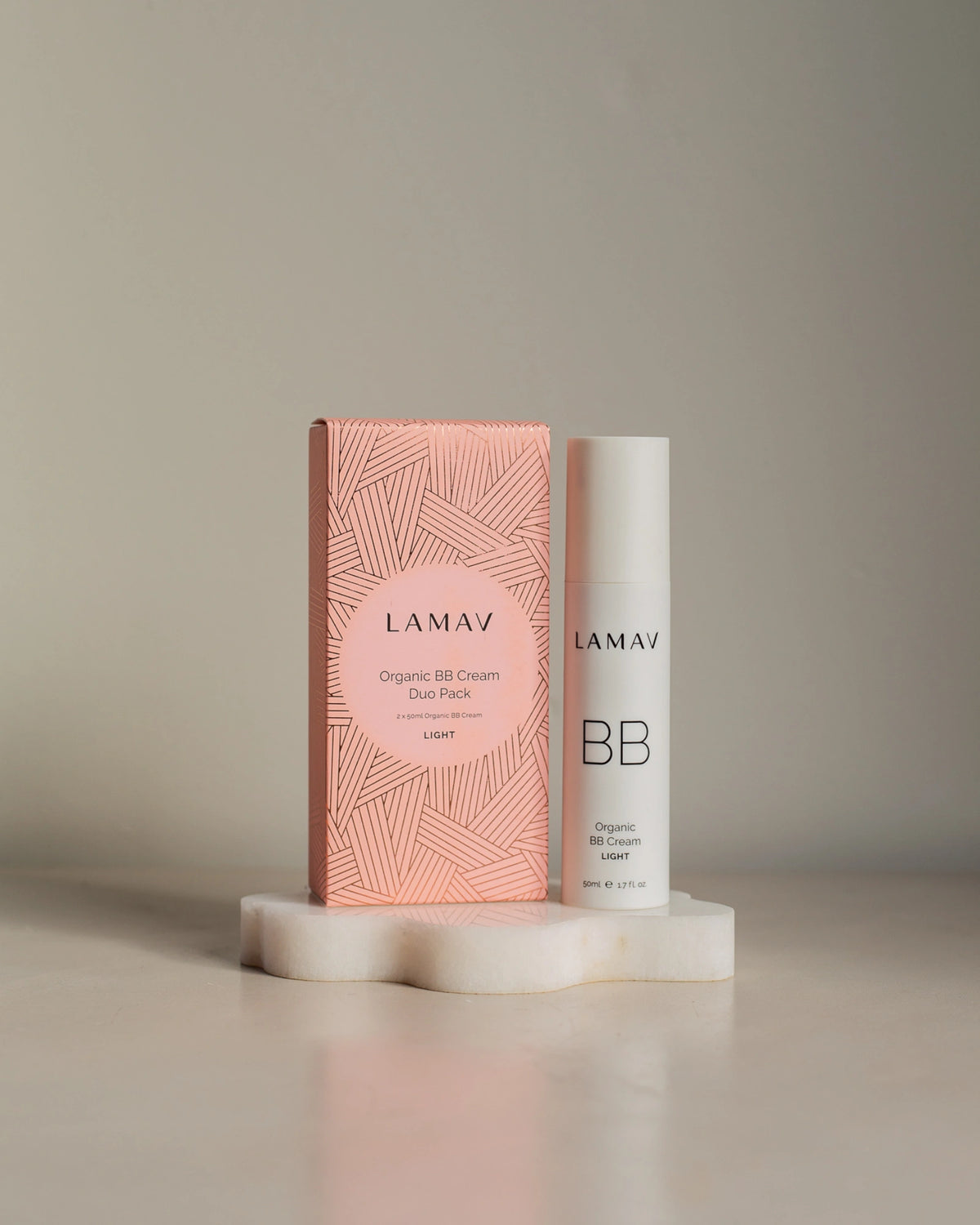 Organic BB Cream Duo Pack by LAMAV — light bottle and box on white stand | Daily color correction