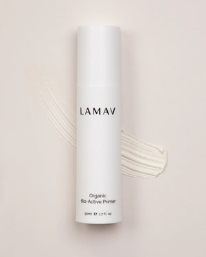 Organic Bio-Active Primer by LAMAV — bottle on a cream texture swatch | smooth base for makeup