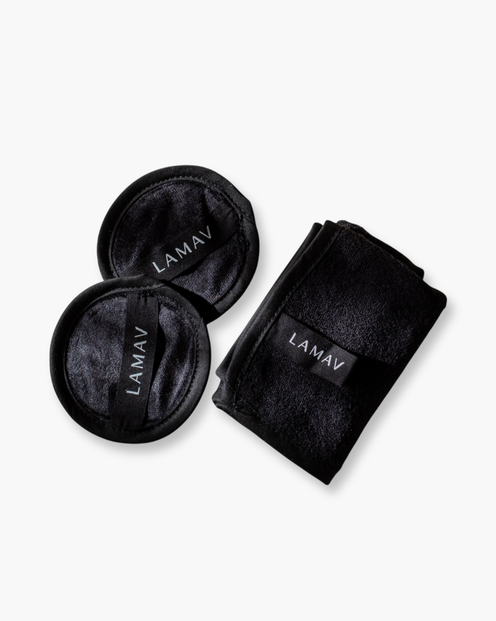 Reusable Bamboo Cleansing Facial Cloth & Makeup Wipes by LAMAV — two round pads and one folded cloth isolated on white | eco-friendly makeup removal
