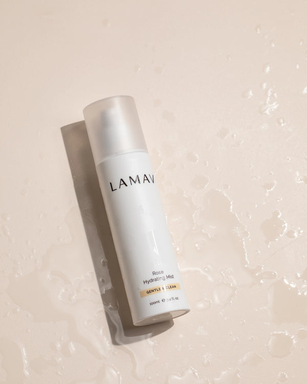 Rose Hydrating Mist by LAMAV — bottle lying among water splashes | intense organic hydration