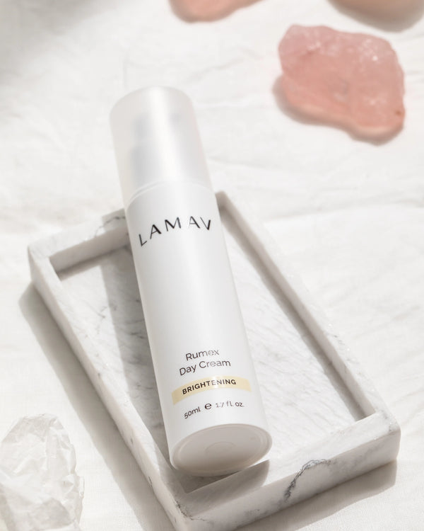 Rumex Advanced Lightening Cream by LAMAV — bottle in marble tray with pink crystal | radiant complexion