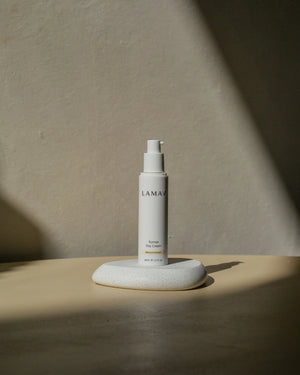 Rumex Advanced Lightening Cream by LAMAV — bottle on white stone with shadow | brightens dull skin