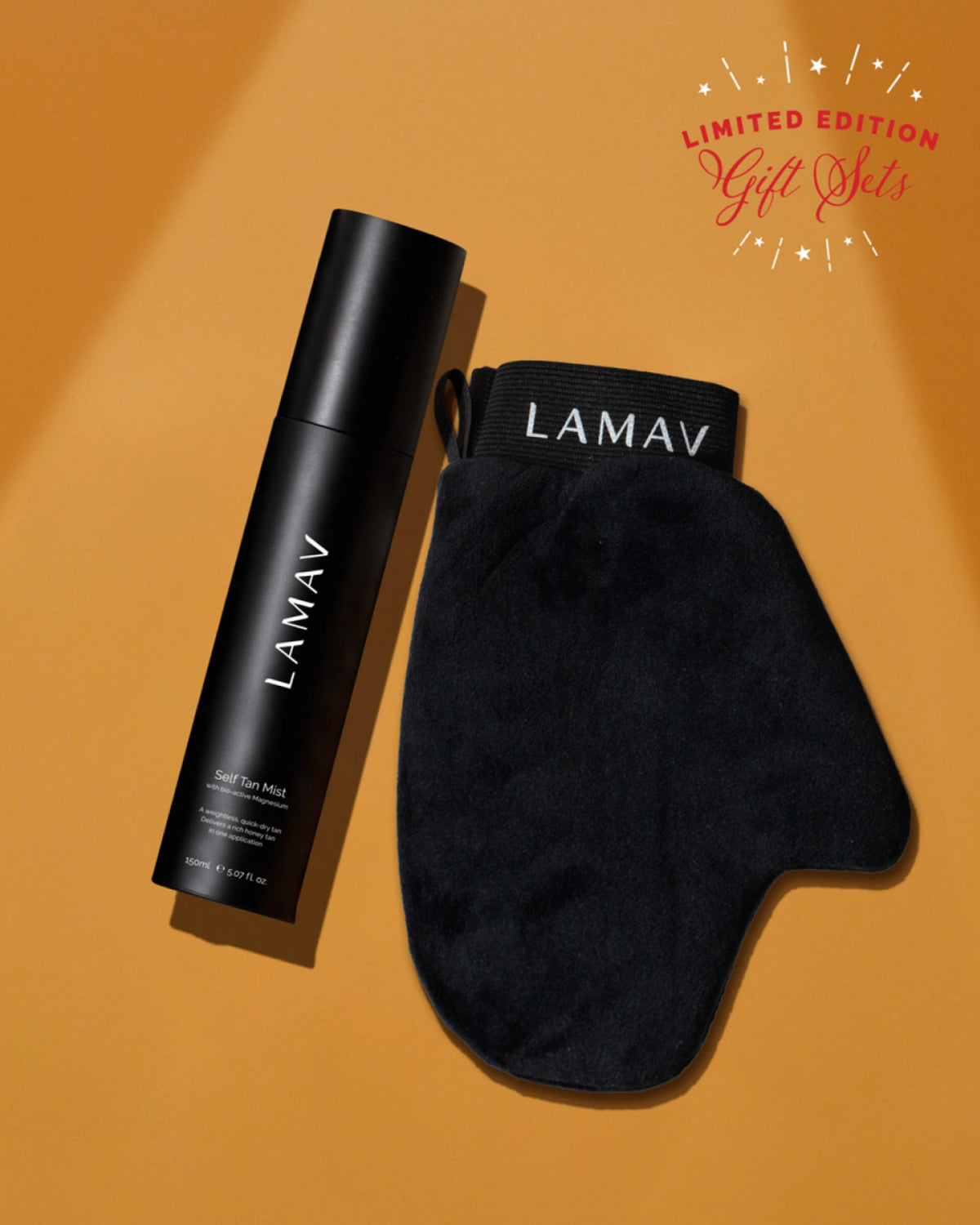 Self Tan Mist Gift Set by LAMAV — black bottle and mitt on warm orange background | flawless sun-kissed glow