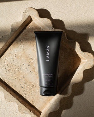 Self Tanning Lotion Medium by LAMAV — tube resting on stone tray | luxurious organic skincare