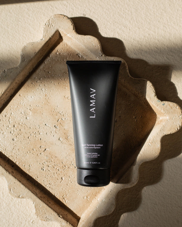 Self Tanning Lotion Medium by LAMAV — tube resting on stone tray | luxurious organic skincare