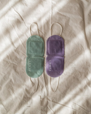 Self-Warming Eye Mask by LAMAV — green and purple masks flat on sheet | dual scent options