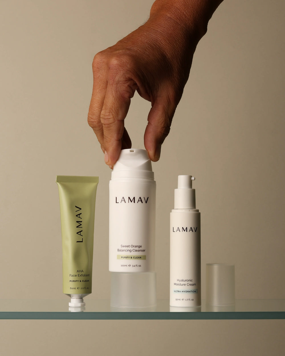 Skincare Bundle by LAMAV — hand lifting cleanser cap next to exfoliant and cream | complete daily routine