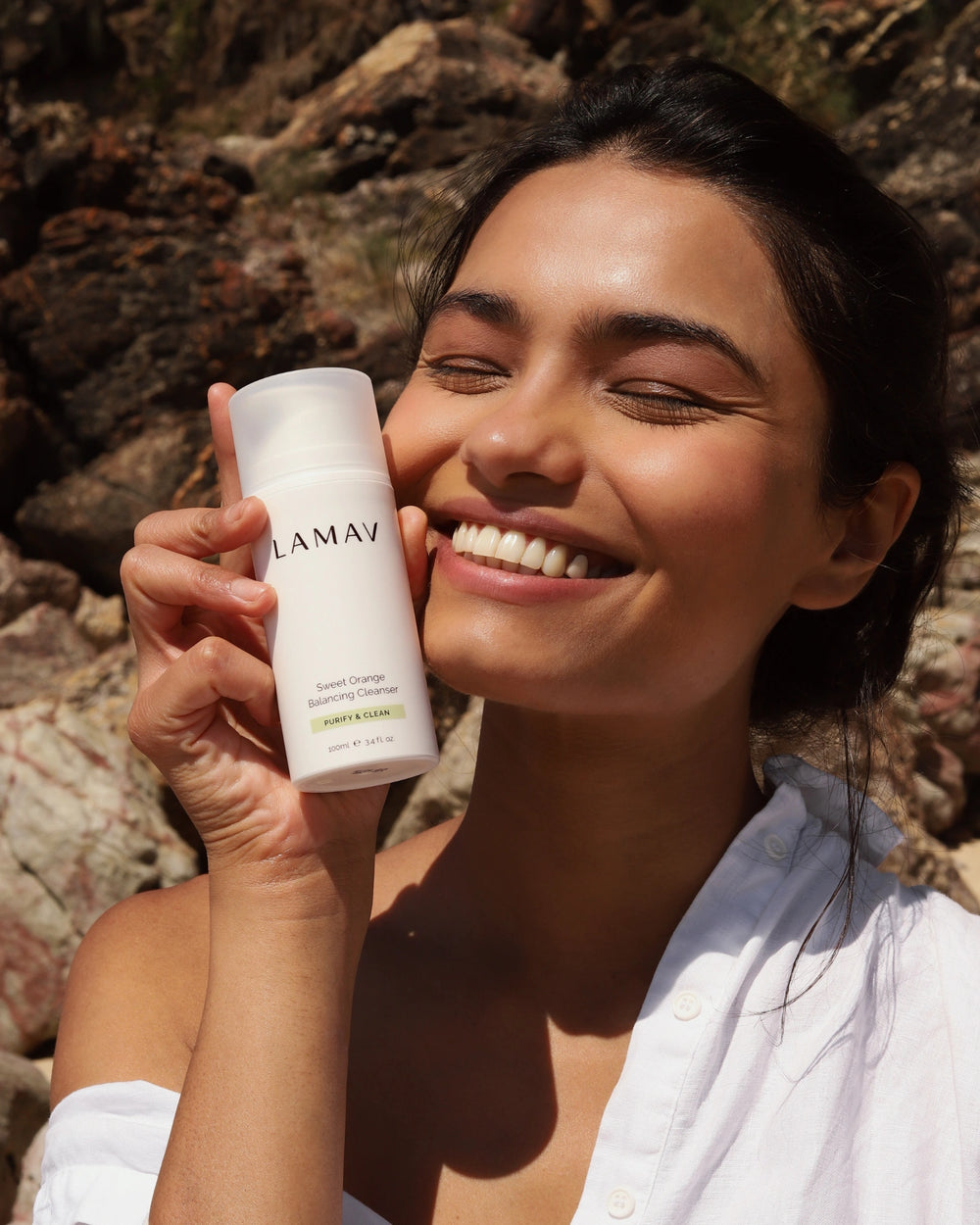 Sweet Orange Balancing Cleanser by LAMAV — bottle next to industry awards | award-winning natural skincare