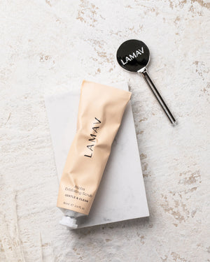 Tube Key by LAMAV — silver key next to beige scrub tube on stone | zero waste skincare tool