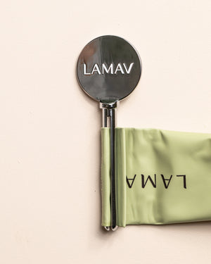 Tube Key by LAMAV — close up of silver key squeezing green tube | effortless product dispensing