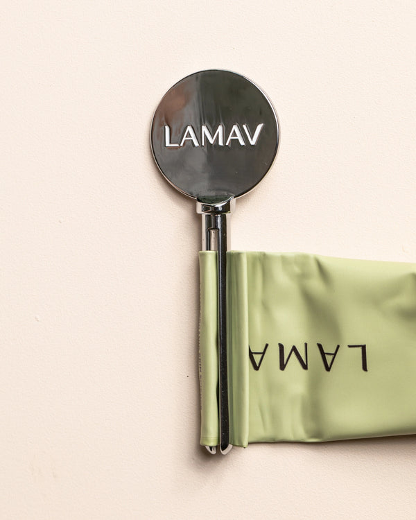 Tube Key by LAMAV — close up of silver key squeezing green tube | effortless product dispensing