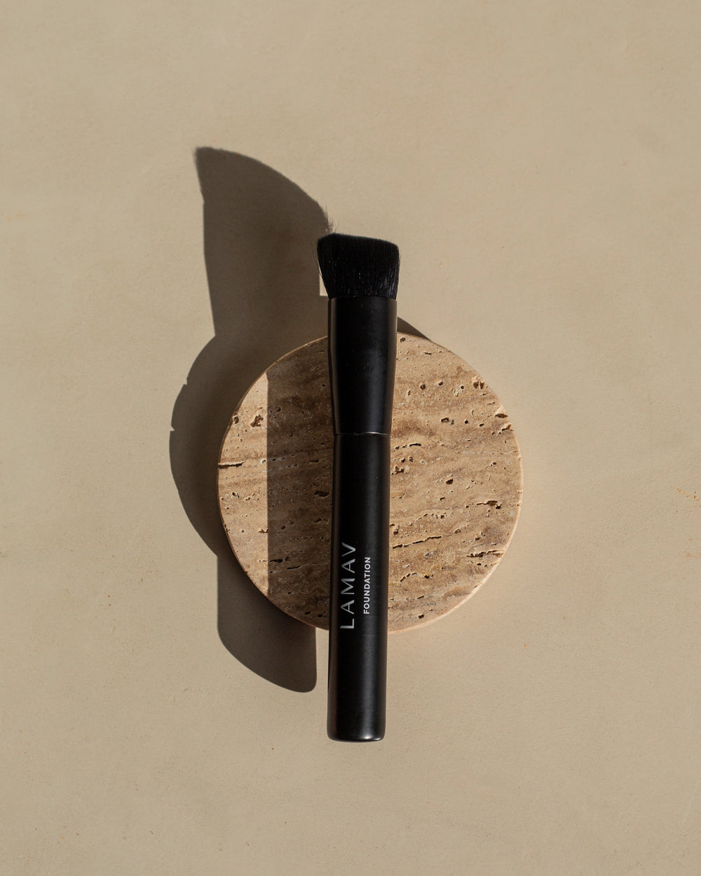 Vegan Foundation Brush by LAMAV — black brush standing upright on white background | cruelty-free makeup tool