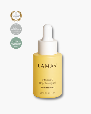 Vitamin C Brightening Oil by LAMAV — bottle next to clean beauty award badges | award-winning organic brightening serum