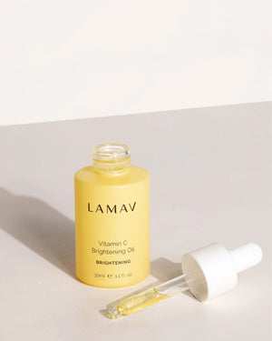 Vitamin C Brightening Oil by LAMAV — open bottle with dropper resting on surface | targets dark spots and dullness
