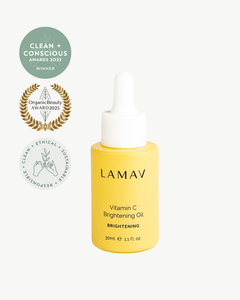 Vitamin C Brightening Oil by LAMAV — bottle next to clean beauty award badges | award-winning organic brightening serum
