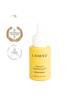 Vitamin C Brightening Oil by LAMAV — bottle next to clean beauty award badges | award-winning organic brightening serum