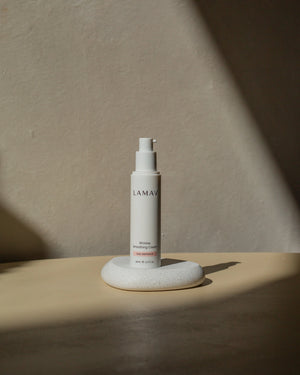 Wrinkle Smoothing Cream by LAMAV — pump bottle resting on a small white stone | firms and smooths mature skin